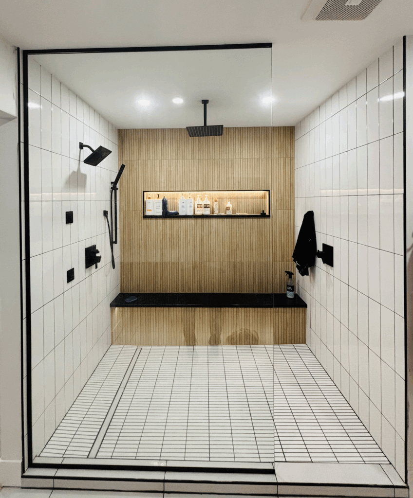 A custom bathroom remodel in Duluth includes a luxurious walk-in tile shower, created by Royal Kitchen & Bathroom Remodels.