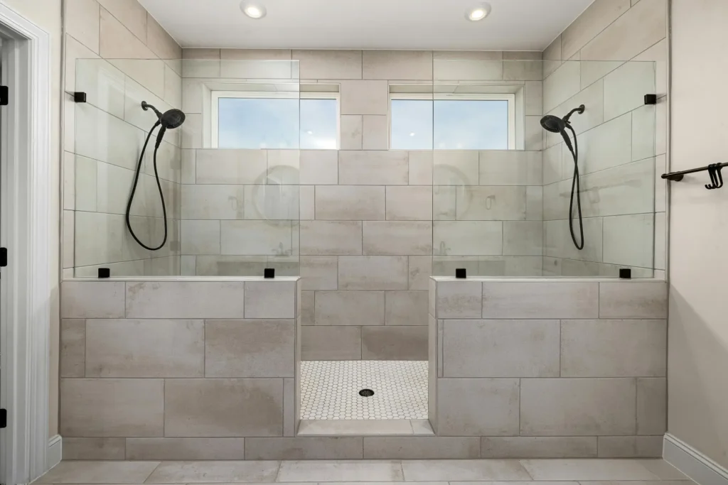 A beautiful double shower featuring custom bathroom tile installation by Royal Kitchen & Bathroom Remodels in Duluth, MN