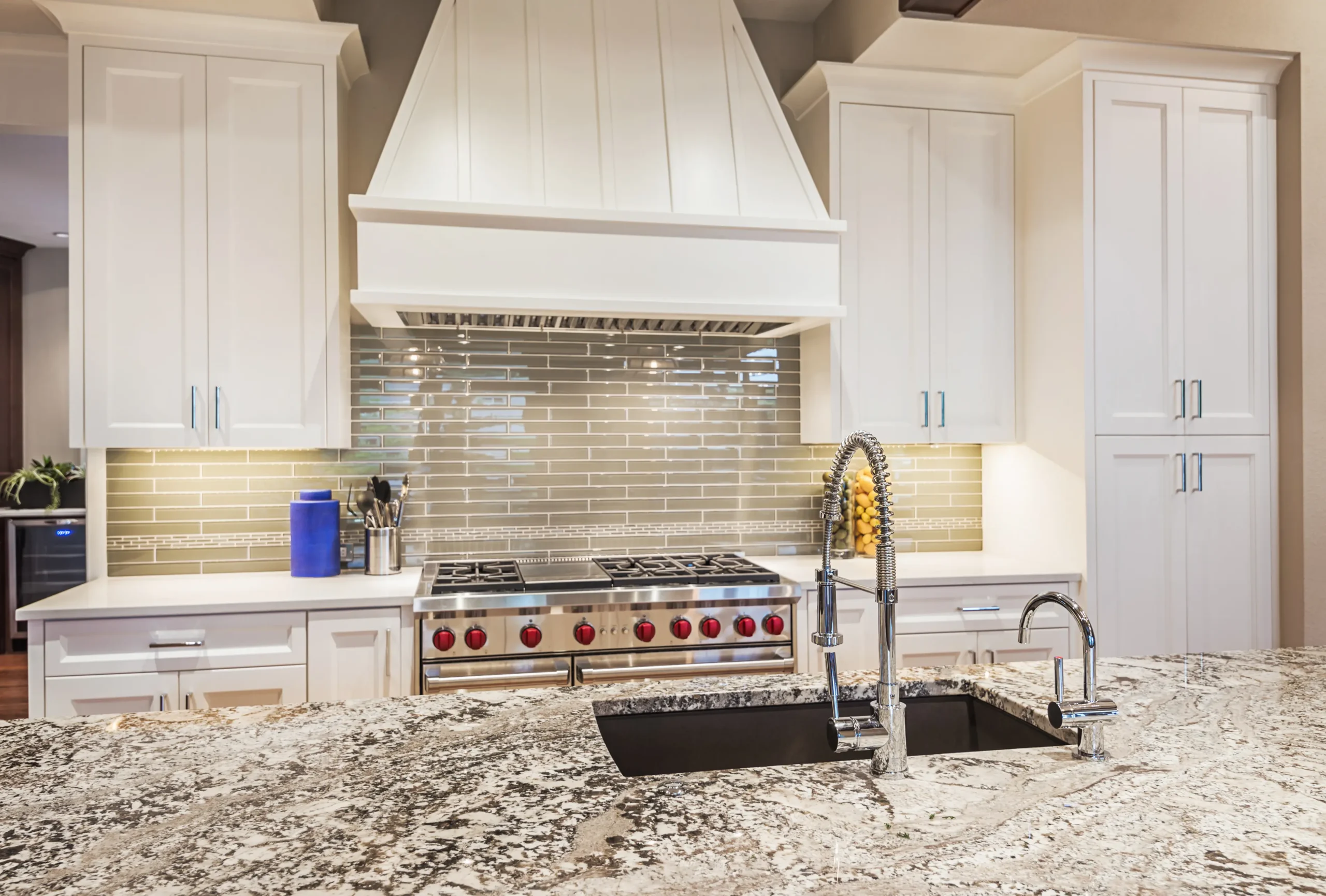 Custom kitchen remodel with island and tile backsplash by Royal Kitchen & Bathroom Remodels in Duluth.