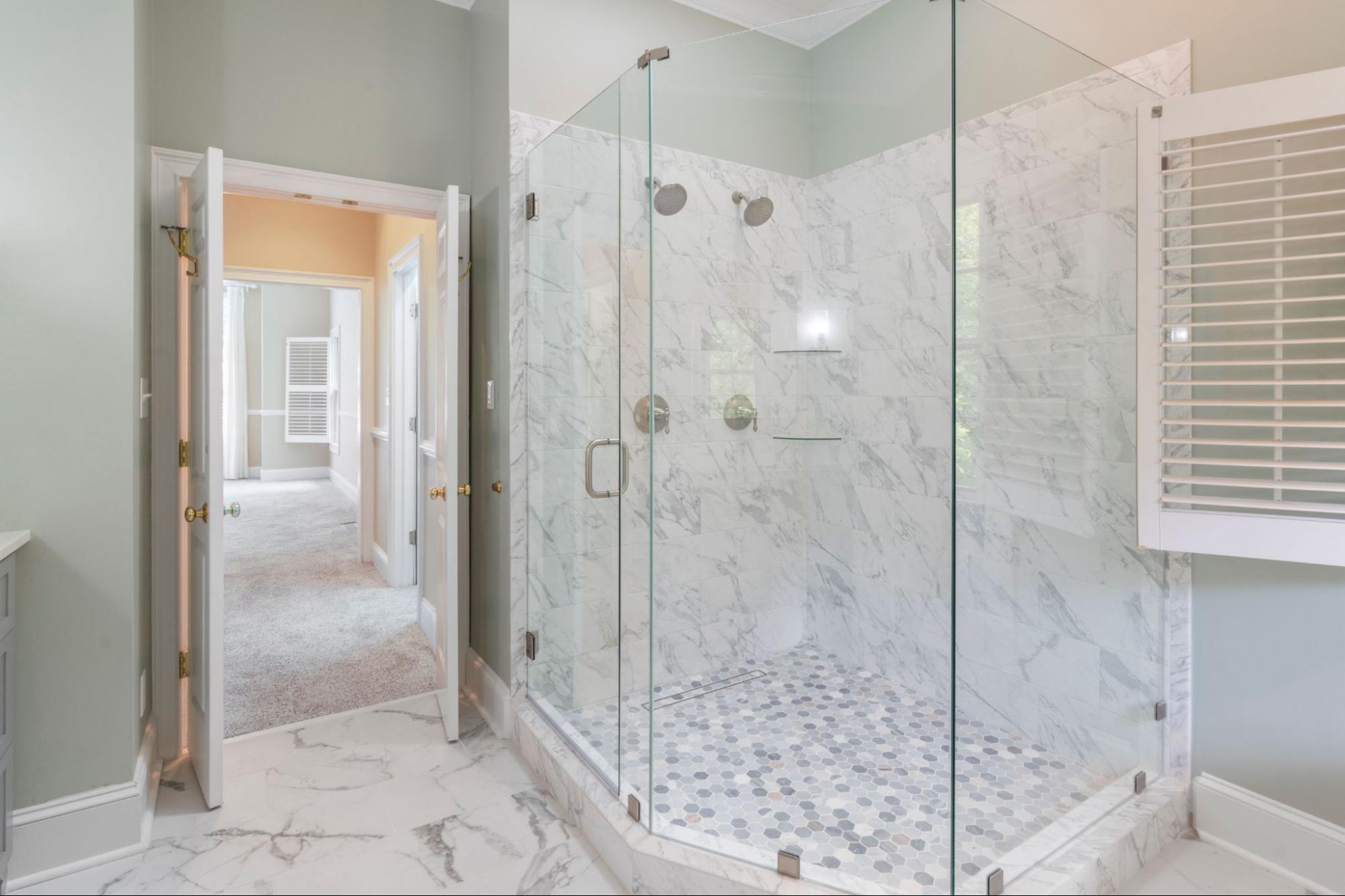 Frameless glass walk-in shower built during a tub to shower conversion by Royal.